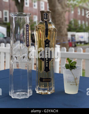 New York, NY - June 11, 2016: Bottle of St. Germain liquor & glass of cocktail on display at 11th annual Jazz Age lawn party by Michael Arenella & Dreamland Orchestra on Governors Island Stock Photo