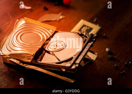 Broken and open computer or laptop hard drive Stock Photo