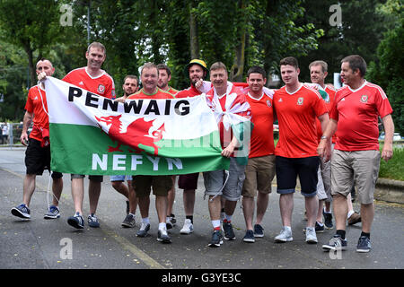 Wales supporters make their way to the game ahead of the UEFA Euro 2016, Group B match at the Stade Felix Bollaert-Delelis, Lens. Stock Photo