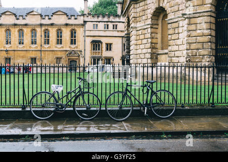 Oxford, UK - August 12, 2015: Bicycles parked in the fence of Radcliffe Camera in Oxford. Stock Photo