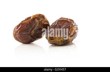 two fresh best quality dates isolated on white background Stock Photo