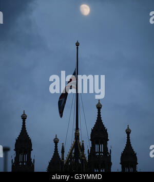 A Union flag is flown at half mast at the Palace of Westminster, in central London, in respect of Labour MP Jo Cox, who died after being shot and stabbed in the street outside her constituency advice surgery in Birstall, West Yorkshire. Stock Photo
