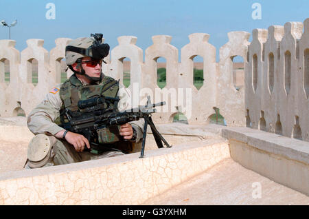 U.S. Army Specialist provides cover with an MK48 Light Machine Gun. Stock Photo