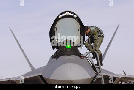 Captain exits an F-22 Raptor. Stock Photo