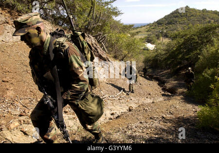 Soldiers conducting a dismounted patrol in Guantanamo Bay, Cuba. Stock Photo