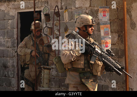 Army soldiers keeping an eye on the surroundings as they conduct a combat patrol in Tall Afar, Iraq. Stock Photo