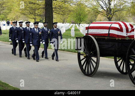 United States Air Force Honor Guard members marching behind a caisson at Arlington National Cemetery. Stock Photo