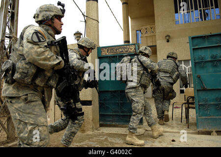 U.S. Soldiers conduct a cordon and search with Iraqi army soldiers ...