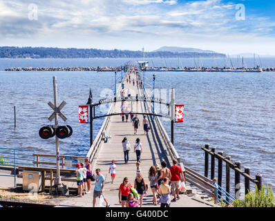 Whiterock, Canada - July 23, 2010: Locals and tourists stroll along the famous 1,500 ft. long pier in White Rock near Vancouver, Stock Photo