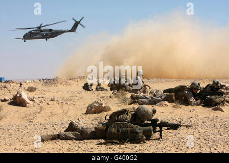 Marines set up security in Egypt as a CH-53E Super Stallion takes off. Stock Photo