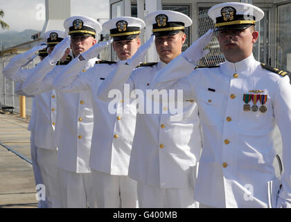 Officers render honors during a change of command ceremony. Stock Photo