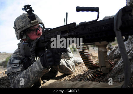 U.S. Army Soldier provides security while on patrol in Afghanistan. Stock Photo