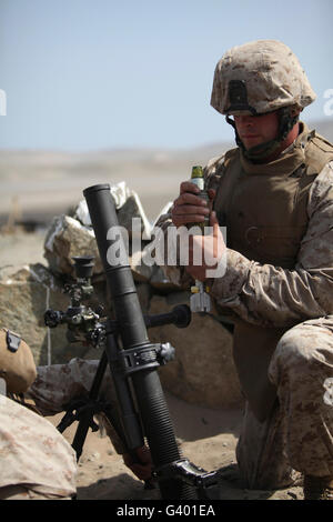 A U.S. Marine loads a mortar into a mortar tube Stock Photo - Alamy