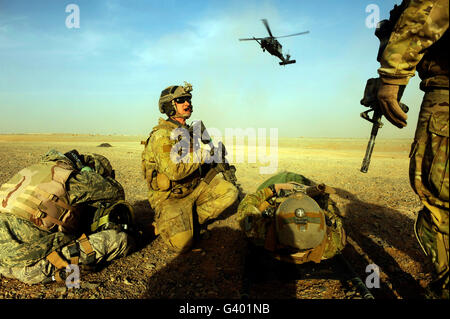 U.S. Air Force members prepare to load casualties on an HH-60 Pave Hawk.