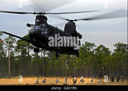 U.S. Army Special Forces fast rope from a CH-47 Chinook. Stock Photo