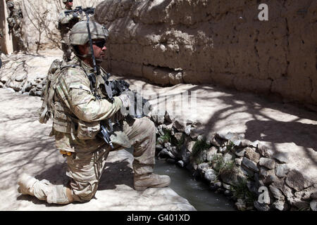 U.S. Army soldier provides security during a patrol in Afghanistan. Stock Photo