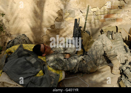 U.S. Army Specialist takes a nap. Stock Photo