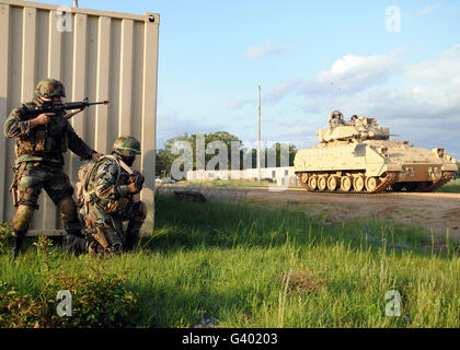 Seabees prepare to assault a simulated insurgent compound. Stock Photo