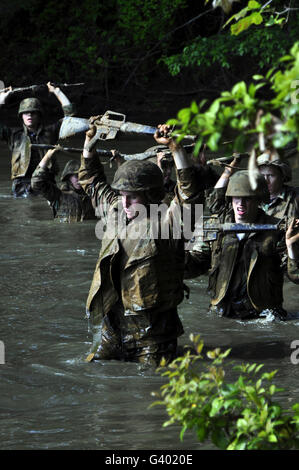 Midshipmen cross a creek during sea trials. Stock Photo