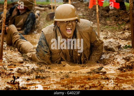 U.S. Naval Academy plebes navigate the low crawl obstacle during Sea Trials. Stock Photo