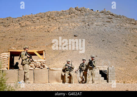 Soldiers wait for Afghan National Police members at the district center in Mizan, Afghanistan. Stock Photo