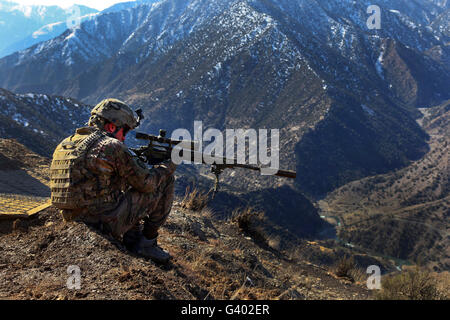 U.S. Army Sniper provides security at an observation post in Afghanistan. Stock Photo