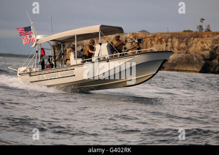 U.S. Coast Guard patrols the coastline of Guantanamo Bay. Stock Photo