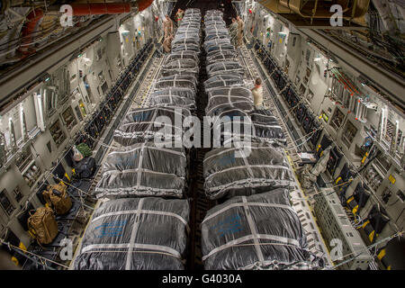 Airmen prepare pallets on a C-17 Globemaster III. Stock Photo