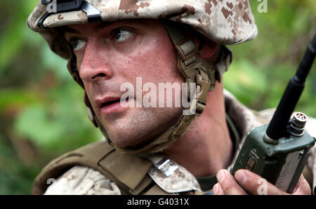 U.S. Marine calls for helicopter support. Stock Photo