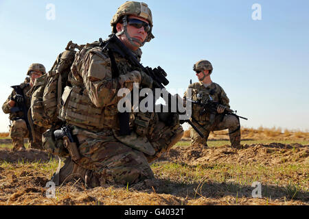 U.S. Navy Petty Officer takes a break with fellow team members. Stock Photo