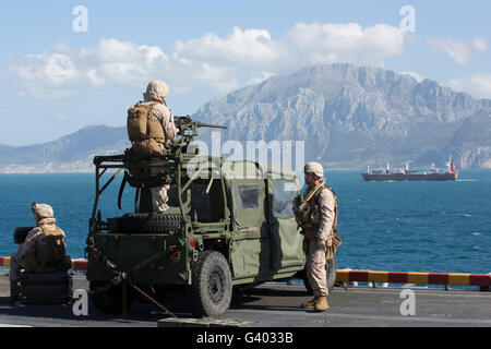 Marines stand watch on the flight deck of USS Kearsarge. Stock Photo