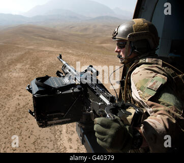 An Afghan Air Force aerial gunner flies on an Afghan Air Force Mi-17 ...