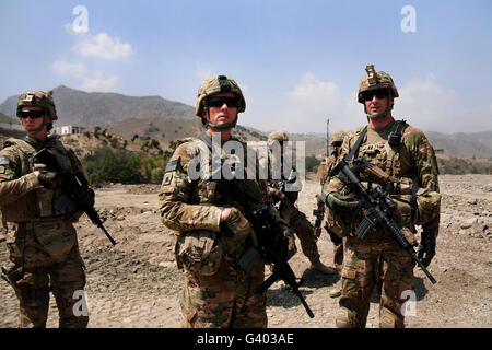 U.S. troops survey the land in Afghanistan. Stock Photo