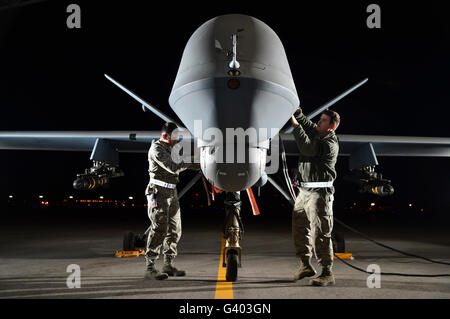 Airmen prepare an MQ-9 Reaper for flight. Stock Photo