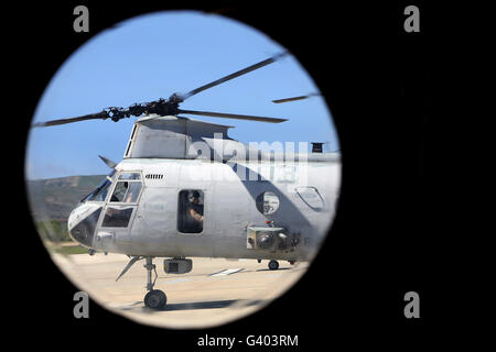 A U.S. Marine prepares for take off in a CH-46E Sea Knight. Stock Photo