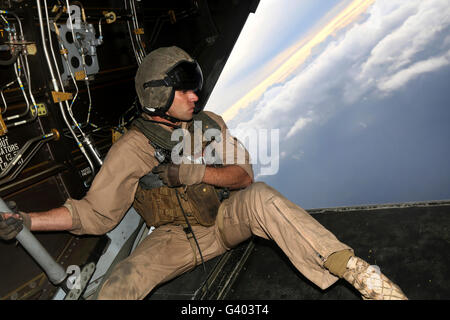 U.S. Marine provides aerial security from a MV-22 Osprey. Stock Photo