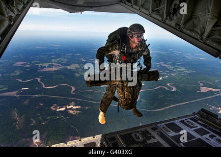 A U.S. Air Force combat controller jumps out of an MC-130J Commando II. Stock Photo