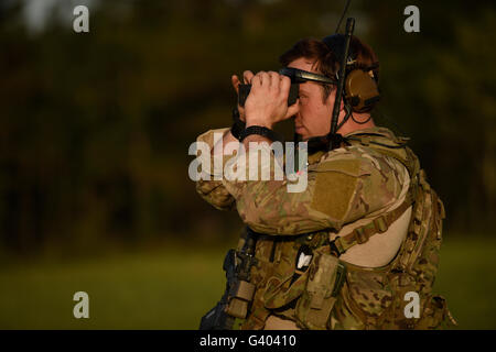 A U.S. Air Force combat controller checks target distance. Stock Photo