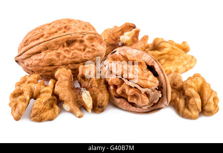 Nuts on white. Whole and shelled walnuts isolated on white background. Stock Photo