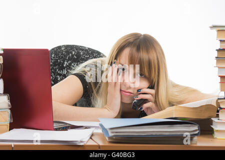 Tired researcher is calling on the phone Stock Photo