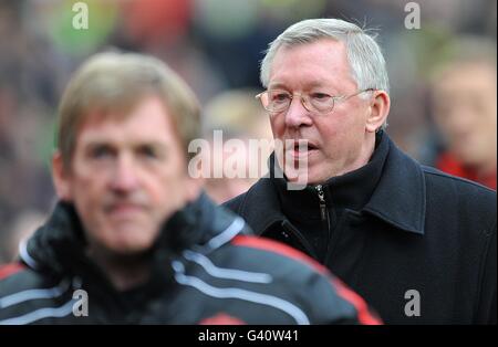 Liverpool manager Kenny Dalglish (left) and Manchester United manager Alex Ferguson (right) make their way towards pitchside before the match Stock Photo