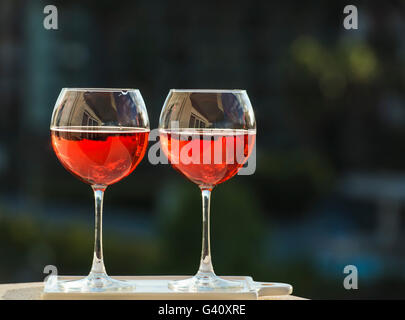 Two glasses of rose wine, dark green background Stock Photo