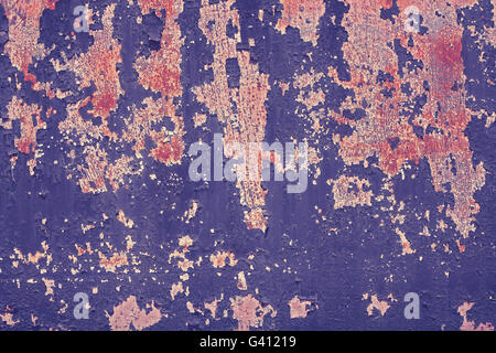 Retro toned peeling paint on metal surface, grunge background. Stock Photo