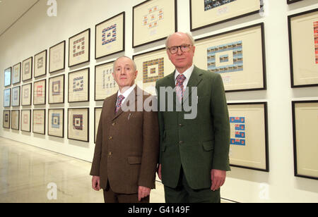 Artists Gilbert Proesch (left) and George Passmore (right) with their Urethra Postcard Art at White Cube in London. Stock Photo