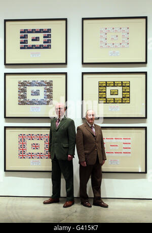 Artists Gilbert Proesch (right) and George Passmore (left) with their Urethra Postcard Art at White Cube in London. Stock Photo