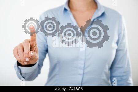 businesswoman pressing web internet icons on the digital touch screen of a tablet pc or a smart mobile phone Stock Photo