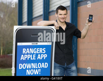 SPECIAL PICTURE - RELEASED EXCLUSIVELY THROUGH THE PRESS ASSOCIATION FOR USE BY NATIONAL AND REGIONAL NEWSPAPERS - UK & IRELAND ONLY. NO SALES. Lee McCulloch promotes the new Rangers application with apple at murray Park, Glasgow. Picture date: Monday January 17, 2011. Photo credit should read: Kirk O'Rourke/Rangers FC/PA. FOR MORE RANGERS PICTURES OR LICENSING OF THESE IMAGES FOR OTHER USE - PLEASE CONTACT EMPICS - 0115 844 7447 OR info@empics.com Stock Photo