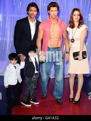 Bollywood actor Hrithik Roshan pictured with his wife Suzanne Khan and children Hrehaan and Hridhaan as he unveils his new waxwork at Madame Tussauds in London. Stock Photo