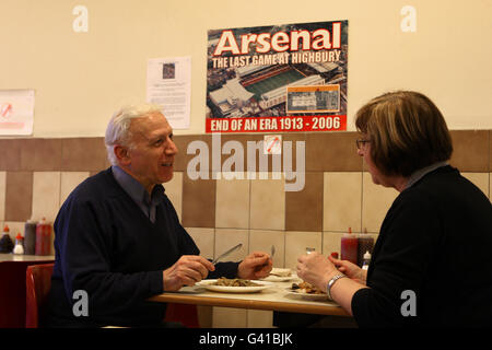 People eat in the Park Cafe near the site of the former home of Arsenal Football Club, Highbury Stadium. Used by the club from 1913 until 2006 when the club moved to the nearby Emirates Stadium. The site is now a residential development Stock Photo