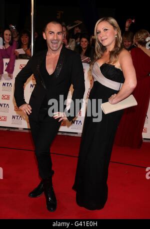 National Television Awards 2011 - Arrivals - London. Louie Spence (left) and guest arriving for the 2011 National Television Awards at the O2 Arena, London. Stock Photo